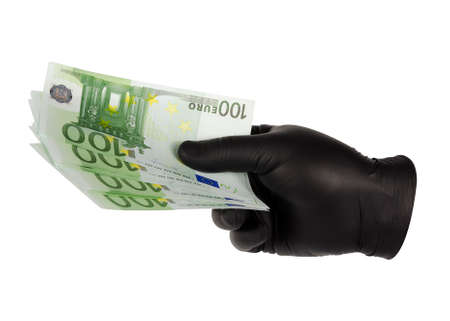 hands in black gloves hold euro billsの写真素材