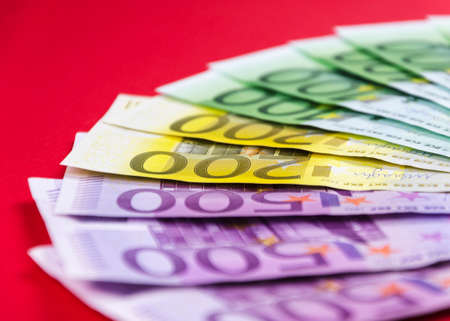 currency of the European Union of different denominations on an red background 6の写真素材