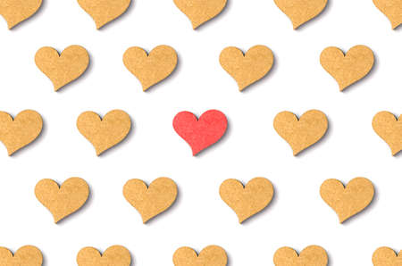 wooden heart pattern with shadow on white backgroundの写真素材