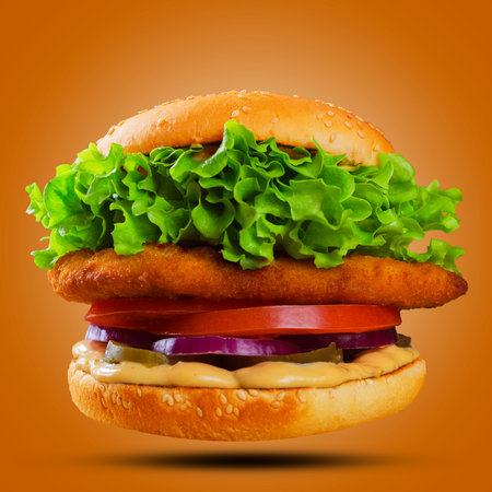 appetizing burger on a orange backgroundの写真素材