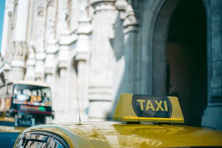 Yellow taxi car in the city centerの写真素材