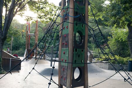 Modern outdoor playground with slides and climbing frames