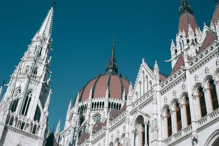 Budapest Parliament Building in the afternoon against a clear blue skyの写真素材