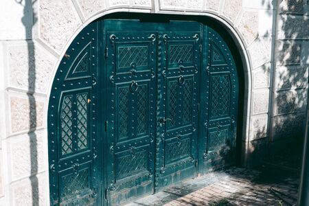 Old wooden door with carvingsの写真素材