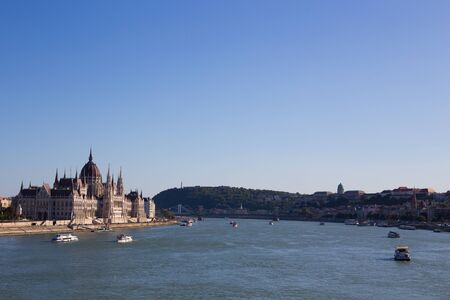 Budapest Parliament Building in the afternoon against a clear blue skyの写真素材