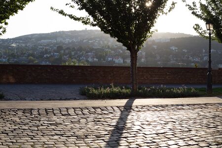 Sunset on a background of a hill in the old town
