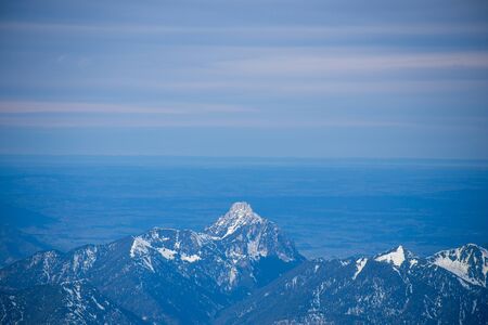 High alpine mountains with snow in Germany and blue beautiful skyの写真素材