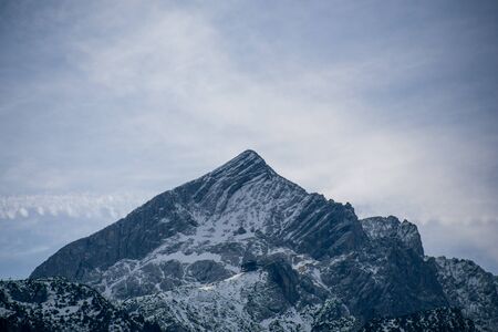High alpine mountains with snow in Germany and blue beautiful skyの写真素材