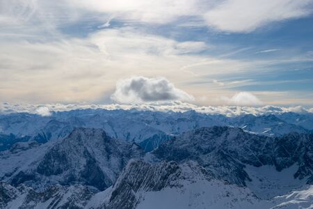 High alpine mountains with snow in Germany and blue beautiful sky