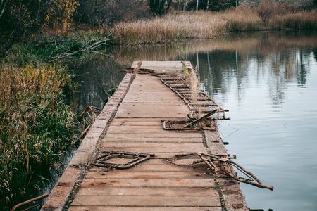 Abandoned pier on the lake in Pripyat in Chernobylの写真素材