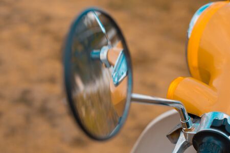 Reflection in the side mirror of a motorbikeの写真素材