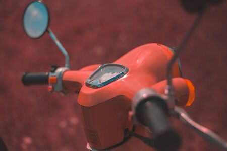 Pink vintage motorbike in the field