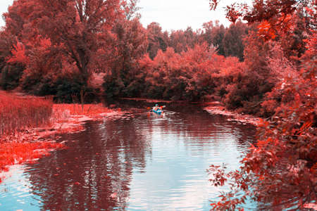 A guy and a girl canoe paddling the river