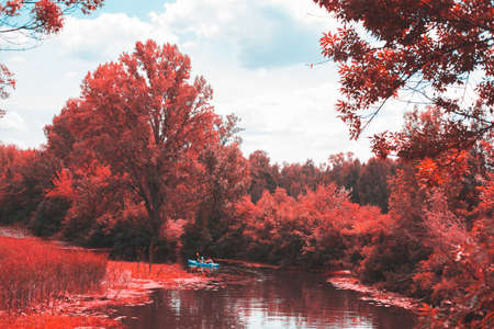 A guy and a girl canoe paddling the riverのeditorial素材