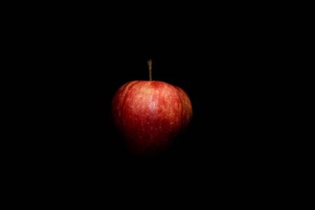 Red ripe apple on a black backgroundの写真素材