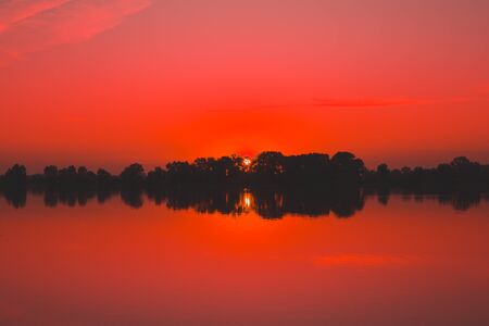 Red saturated sunset on the river