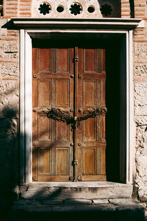 Old wooden carved door of a house