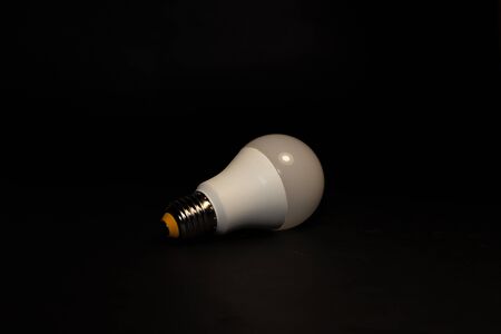 White light bulb e27 on a black backgroundの写真素材