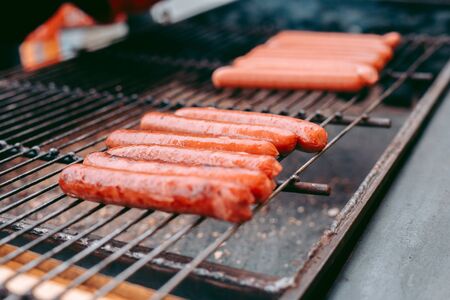 Delicious fresh hot dogs on the grillの写真素材