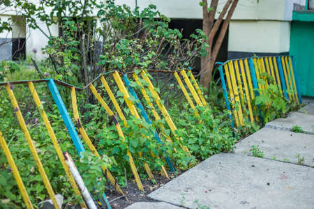 Old abandoned fence on the street