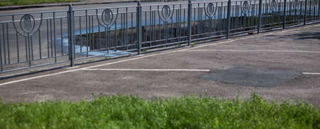 Old abandoned fence on the street