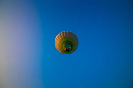 Big balloon flies against the skyの写真素材