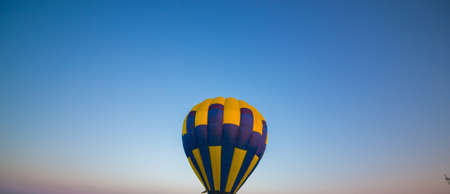 Big balloon flies against the skyの写真素材