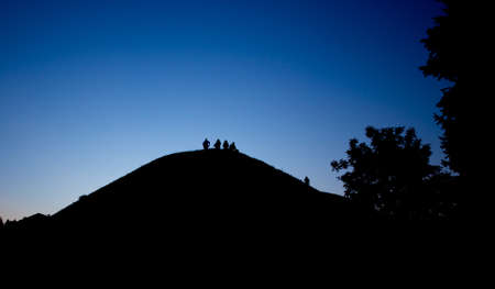 Silhouette of a group of people against the skyの写真素材