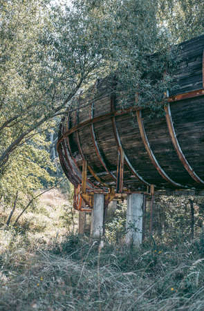 Old abandoned wooden bobsleigh track in summer by daylightの写真素材