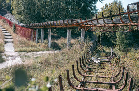 Old abandoned wooden bobsleigh track in summer by daylightの写真素材