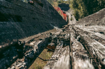 Old abandoned wooden bobsleigh track in summer by daylightの写真素材