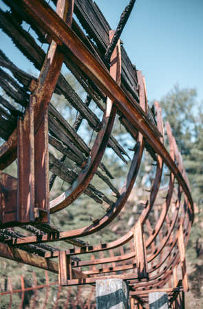 Old abandoned wooden bobsleigh track in summer by daylightの写真素材