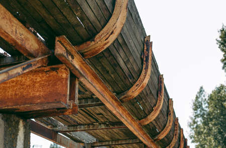 Old abandoned wooden bobsleigh track in summer by daylightの写真素材