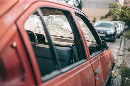Old wrecked abandoned car after an accident in the city