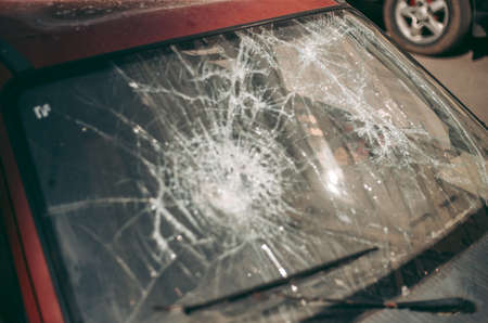 Old wrecked abandoned car after an accident in the cityの写真素材