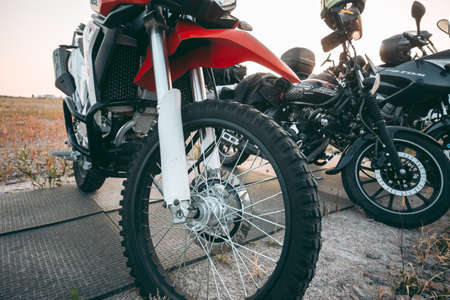 Kyiv, Ukraine 10.02.2020: Sports bike parked in a field under morning light