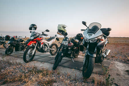 Kyiv, Ukraine 10.02.2020: Sports bike parked in a field under morning light