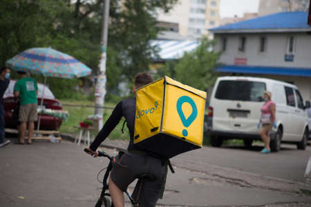 Glovo courier for food delivery by bikeのeditorial素材