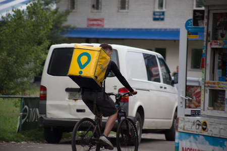 Glovo courier for food delivery by bike