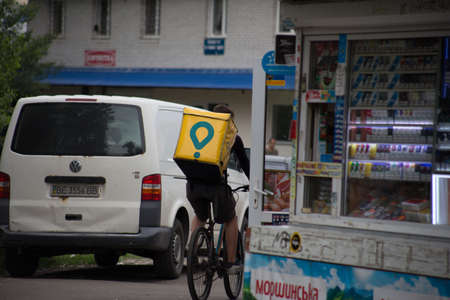 Glovo courier for food delivery by bikeのeditorial素材