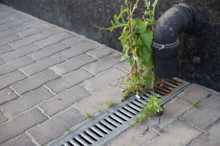 Storm drain for rain and ground water from impervious surfaces