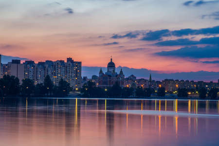 Bright night embankment on the banks of the Dnieper on Obolon