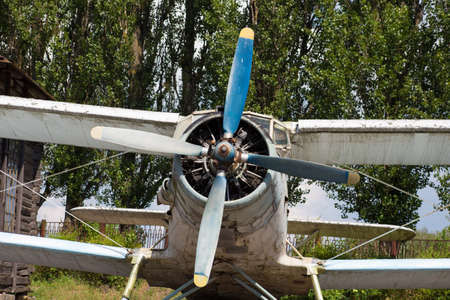 Old abandoned biplane in daylight