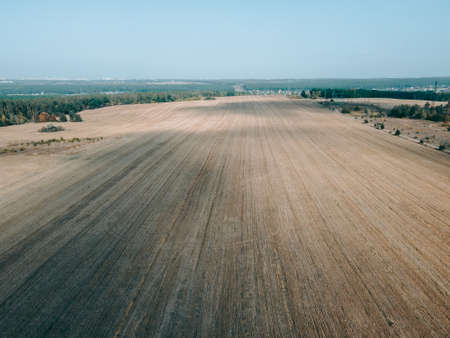 Aerial view of an open field during the day