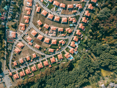 Aerial view of a cottage town with identical houses