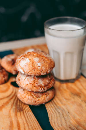 Freshly baked aromatic homemade cakes with a glass of milk