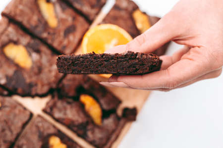 Freshly baked aromatic chocolate brownie with orangeの写真素材