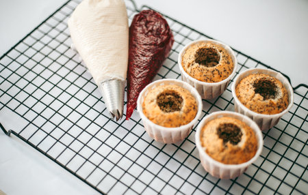 Delicious appetizing fresh baked muffins in the kitchen close upの写真素材