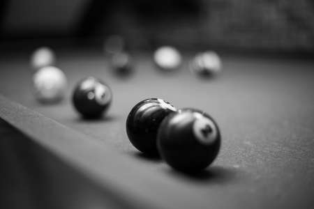 Billiard table in the billiard room with balls and cueの写真素材