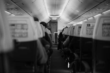 Inside the passenger plane inside the cabin in black and whiteの写真素材